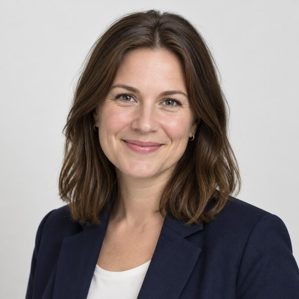 Professional woman with dark hair smiling